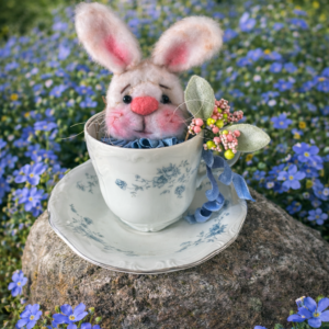 teacup bunny sitting in teacup